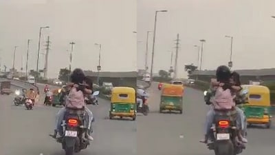 Couple's PDA on moving bike. (Twitter/@buntea) Couple's PDA on moving bike. (Twitter/@buntea)