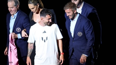 Lionel Messi and David Beckham talk during Inter Miami CF Hosts "The Unveil" at DRV PNK Stadium. (Getty Images via AFP) Lionel Messi and David Beckham talk during Inter Miami CF Hosts "The Unveil" at DRV PNK Stadium. (Getty Images via AFP)