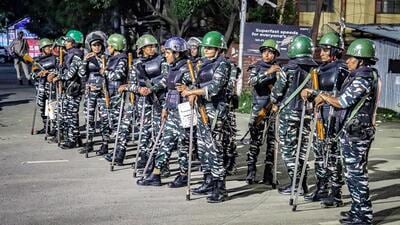 Security personnel stand guard during a protest by women, in Imphal (ANI) Security personnel stand guard during a protest by women, in Imphal (ANI)