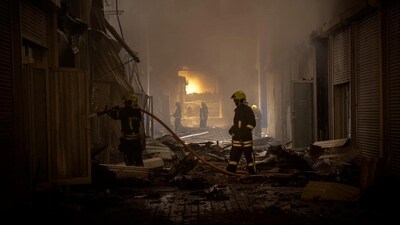 Firefighters work at a site of storage facilities hit during Russian missile and drone strikes, amid Russia's attack on Ukraine, in Odesa, Ukraine July 19, 2023. (Reuters)