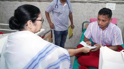 West Bengal CM and Trinamool Congress (TMC) chief Mamata Banerjee presents a cheque to a party supporter injured in the recent state Panchayat election violence in Kolkata on Wednesday. (TMC Twitter) West Bengal CM and Trinamool Congress (TMC) chief Mamata Banerjee presents a cheque to a party supporter injured in the recent state Panchayat election violence in Kolkata on Wednesday. (TMC Twitter)