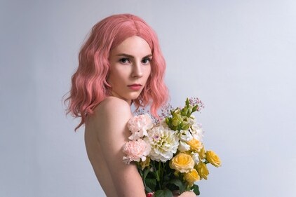 Peach coloured hair adds a touch of edginess and princess vibes to your look. (Unsplash) Peach coloured hair adds a touch of edginess and princess vibes to your look. (Unsplash)