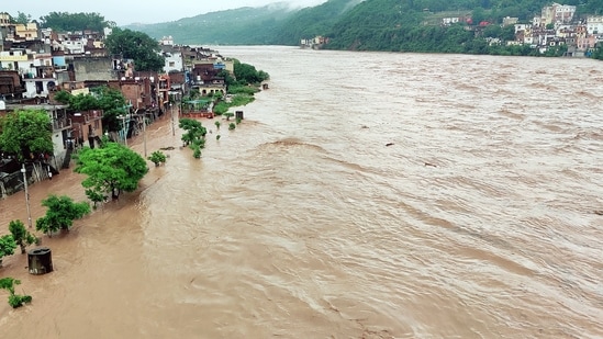An area is heavily flooded due to a rise in the water level of the Tawi River amid torrential rains, in Jammu on Wednesday. (ANI Photo) An area is heavily flooded due to a rise in the water level of the Tawi River amid torrential rains, in Jammu on Wednesday. (ANI Photo)