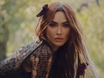 Megan Fox confidently stuns in a sheer knit dress.
