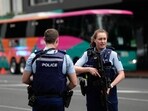 Armed New Zealand police officers stand outside a hotel housing a team from the FIFA Women's World Cup in the central business district following a shooting in Auckland, New Zealand. Armed New Zealand police officers stand outside a hotel housing a team from the FIFA Women's World Cup in the central business district following a shooting in Auckland, New Zealand.