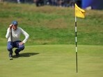 South Africa's Christo Lamprecht lines up a putt on the 18th green during the first round.