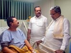 Karnataka CM Siddaramaiah meets BJP MLA Basanagowda Patil Yatnal, who fell ill during a protest in the Assembly, at a hospital in Bengaluru on Wednesday.