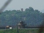 A North Korean military guard post, background, and a South Korean post, front, are seen in Paju South Korea, Thursday, July 20, 2023. 