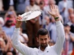 Serbia's Novak Djokovic with the runners-up trophy after losing to Spain's Carlos Alcaraz in the men's final 