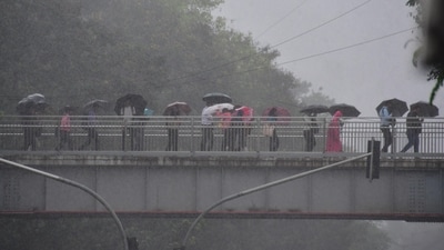 Heavy rains lashed Mumbai and adjoining Thane and Palghar districts on Wednesday, disrupting suburban rail traffic and causing water-logging in low-lying areas from where people were evacuated. (HT Photo/Bhushan Koyande) Heavy rains lashed Mumbai and adjoining Thane and Palghar districts on Wednesday, disrupting suburban rail traffic and causing water-logging in low-lying areas from where people were evacuated. (HT Photo/Bhushan Koyande)