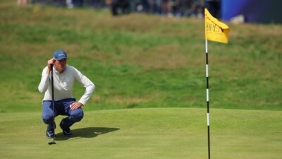 South Africa's Christo Lamprecht lines up a putt on the 18th green during the first round. (REUTERS)