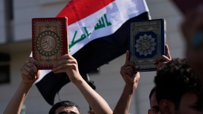 Supporters of the Shiite cleric Muqtada al-Sadr raise the Quran, the Muslims' holy book, during a demonstration in front of the Swedish Embassy in Baghdad, on June 30, 2023. (AP) Supporters of the Shiite cleric Muqtada al-Sadr raise the Quran, the Muslims' holy book, during a demonstration in front of the Swedish Embassy in Baghdad, on June 30, 2023. (AP)
