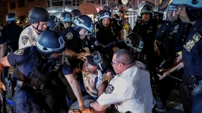 A protester is arrested on New York's Fifth Avenue by NYPD officers during a march on June 4, 2020, following the death of George Floyd (AP Photo/John Minchillo, File) (AP) A protester is arrested on New York's Fifth Avenue by NYPD officers during a march on June 4, 2020, following the death of George Floyd (AP Photo/John Minchillo, File) (AP)
