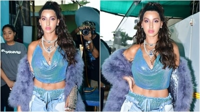 Nora Fatehi poses in a holographic plunge-neck top and quirky inside-out denim pants. (HT Photo/Varinder Chawla) Nora Fatehi poses in a holographic plunge-neck top and quirky inside-out denim pants. (HT Photo/Varinder Chawla)