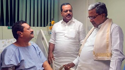 Karnataka CM Siddaramaiah meets BJP MLA Basanagowda Patil Yatnal, who fell ill during a protest in the Assembly, at a hospital in Bengaluru on Wednesday. (PTI) Karnataka CM Siddaramaiah meets BJP MLA Basanagowda Patil Yatnal, who fell ill during a protest in the Assembly, at a hospital in Bengaluru on Wednesday. (PTI)