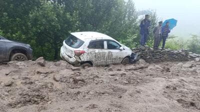 Vehicles being swept away in the flash flood at Kamru panchayat in Sangla Valley of Kinnaur district as residents look on on Thursday. (HT Photo) Vehicles being swept away in the flash flood at Kamru panchayat in Sangla Valley of Kinnaur district as residents look on on Thursday. (HT Photo)