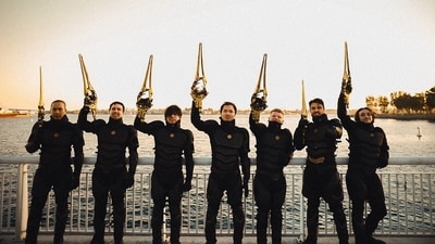 Another picture of the 'raiders' showed some US actors as they took their masks off and posed together. They wielded golden saw-like weapons in the air and smiled for the camera. Another picture of the 'raiders' showed some US actors as they took their masks off and posed together. They wielded golden saw-like weapons in the air and smiled for the camera.