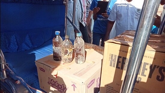 Acid bottles recovered from the room of accused Mohd Arif being seized by the police on Thursday. (HT Photo)