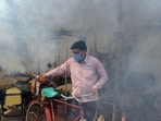 A worker fumigates an area at Yamuna Bazar as dengue cases rise following flooding of the Yamuna river, in New Delhi on Wednesday. (ANI)