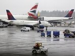 Delta Airlines planes and a British Airways plane (2nd L)