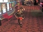 Screengrab of the clip showing the suspect going out of the theatre. Screengrab of the clip showing the suspect going out of the theatre.
