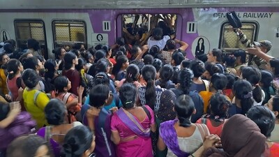 After heavy rain, as the local train is running late, there is a rush of commuters at the Thane railway station in Mumbai. (PTI) After heavy rain, as the local train is running late, there is a rush of commuters at the Thane railway station in Mumbai. (PTI)