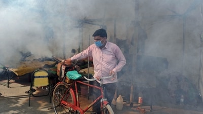 A worker fumigates an area at Yamuna Bazar as dengue cases rise following flooding of the Yamuna river, in New Delhi on Wednesday. (ANI) A worker fumigates an area at Yamuna Bazar as dengue cases rise following flooding of the Yamuna river, in New Delhi on Wednesday. (ANI)