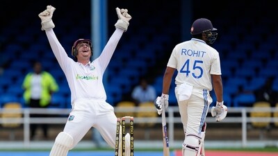 West Indies' keeper Joshua Da Silva celebrates the dismissal of India's captain Rohit Sharma, bowled by Jomel Warrican for 80 runs, on day one of their second cricket Test match (AP) West Indies' keeper Joshua Da Silva celebrates the dismissal of India's captain Rohit Sharma, bowled by Jomel Warrican for 80 runs, on day one of their second cricket Test match (AP)