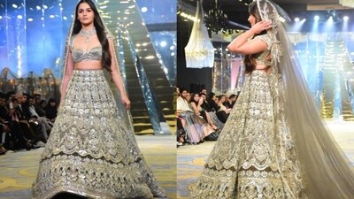 Alia Bhatt, dressed in a lehenga, at Manish Malhotra's show. Alia Bhatt, dressed in a lehenga, at Manish Malhotra's show.