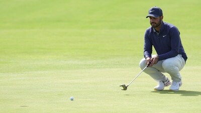 India's Shubhankar Sharma looks at the lie of his putt on the 18th green, he made a birdie putt, during the second day of the British Open Golf Championships at the Royal Liverpool Golf Club in Hoylake. (AP) India's Shubhankar Sharma looks at the lie of his putt on the 18th green, he made a birdie putt, during the second day of the British Open Golf Championships at the Royal Liverpool Golf Club in Hoylake. (AP)