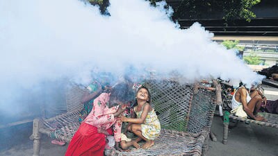 Children react as a municipal worker fumigates a locality to curb the spread of mosquitoes at a flood relief camp near the banks of river Yamuna in New Delhi on Friday . (AFP) Children react as a municipal worker fumigates a locality to curb the spread of mosquitoes at a flood relief camp near the banks of river Yamuna in New Delhi on Friday . (AFP)