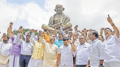 Former Karnataka chief minister Basavaraj Bommai with BJP MLAs stage a protest against the suspension of 10 party MLAs at Vidhana Soudha in Bengaluru on Friday. (ANi) Former Karnataka chief minister Basavaraj Bommai with BJP MLAs stage a protest against the suspension of 10 party MLAs at Vidhana Soudha in Bengaluru on Friday. (ANi)