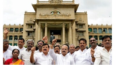 Former CM Basavaraj Bommai with BJP MLAs stages a protest at Vidhana Soudha against the suspension of 10 party MLAs in Bengaluru. (PTI) Former CM Basavaraj Bommai with BJP MLAs stages a protest at Vidhana Soudha against the suspension of 10 party MLAs in Bengaluru. (PTI)