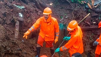 NDRF personnel during a search and rescue operation after a landslide at Irshalwadi village in Raigad district. (PTI) NDRF personnel during a search and rescue operation after a landslide at Irshalwadi village in Raigad district. (PTI)