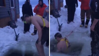 The image shows a man taking a dip into ice-cold water to retrieve his friend's phone. (Reddit/@TheSpace-Guy) The image shows a man taking a dip into ice-cold water to retrieve his friend's phone. (Reddit/@TheSpace-Guy)