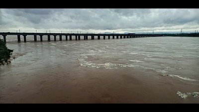The swollen Godavari river flows in spate after heavy monsoon rainfall, in Bhadrachalam on Friday. (PTI) The swollen Godavari river flows in spate after heavy monsoon rainfall, in Bhadrachalam on Friday. (PTI)
