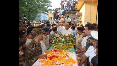 Uttar Pradesh cabinet minister Surya Pratap Shahi paying homage to Army officer Anshuman Singh at the latter’s native place in Deoria on Friday. (HT Photo) Uttar Pradesh cabinet minister Surya Pratap Shahi paying homage to Army officer Anshuman Singh at the latter’s native place in Deoria on Friday. (HT Photo)