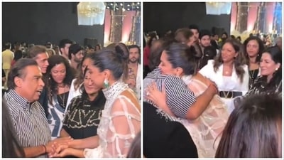 Mukesh Ambani and Deepika Padukone share a hug, have a chat as her Anju Bhavnani (in black) looks on. Mukesh Ambani and Deepika Padukone share a hug, have a chat as her Anju Bhavnani (in black) looks on.