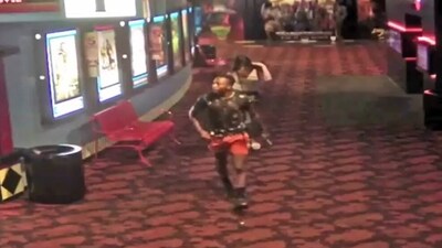 Screengrab of the clip showing the suspect going out of the theatre. (Twitter ) Screengrab of the clip showing the suspect going out of the theatre. (Twitter )