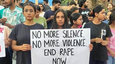 Students taking out candle march against Manipur violence at the campus of Chanakya National Law University (CNLU) in Patna. (Photo by Santosh Kumar / Hindustan Times)