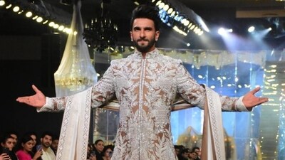 Ranveer poses on the ramp with utmost confidence as he walks for Manish Malhotra's The Bridal Couture Show in Mumbai on Thursday. He was the showstopper of the event along with Alia Bhatt. Ranveer poses on the ramp with utmost confidence as he walks for Manish Malhotra's The Bridal Couture Show in Mumbai on Thursday. He was the showstopper of the event along with Alia Bhatt. 