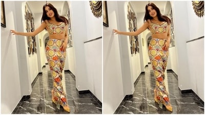 Janhvi's dazzling outfit features a crop top with thin sleeves, plunging neckline and multi-coloured sequin work all over. She paired it up with a matching high waisted bodycon skirt. (Instagram/@janhvikapoor) Janhvi's dazzling outfit features a crop top with thin sleeves, plunging neckline and multi-coloured sequin work all over. She paired it up with a matching high waisted bodycon skirt. (Instagram/@janhvikapoor)