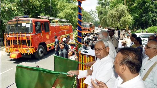 Bihar CM Nitish Kumar flags off fire brigade vehicles in Patna on Friday. (Santosh Kumar/HT)
