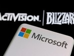 FILE PHOTO: Microsoft logo is seen on a smartphone placed on displayed Activision Blizzard logo in this illustration taken January 18, 2022. REUTERS/Dado Ruvic/Illustration//File Photo