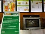 A notice on the temporary unavailability of tomatoes is seen at a Subway outlet at an airport terminal in New Delhi, India, July 22.