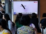 A TV screen shows a file image of North Korea's missile launch during a news program at the Seoul Railway Station in Seoul.