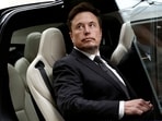 Tesla Chief Executive Officer Elon Musk gets in a Tesla car as he leaves a hotel in Beijing, China.