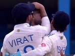 Virat Kohli celebrates with Mukesh Kumar (centre) after the latter's maiden Test wicket Virat Kohli celebrates with Mukesh Kumar (centre) after the latter's maiden Test wicket