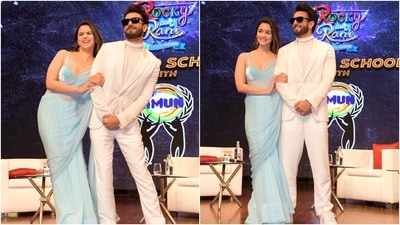 Alia wore an aqua blue-coloured chiffon sheer saree featuring stripes in a contrasting white hue printed on the pallu and pleated lace embroidery on the borders. She draped the six yards around her svelte frame in the traditional style, with the pleats on the front and the pallu falling from the shoulder in a floor-sweeping length. (HT Photo/Varinder Chawla) Alia wore an aqua blue-coloured chiffon sheer saree featuring stripes in a contrasting white hue printed on the pallu and pleated lace embroidery on the borders. She draped the six yards around her svelte frame in the traditional style, with the pleats on the front and the pallu falling from the shoulder in a floor-sweeping length. (HT Photo/Varinder Chawla)