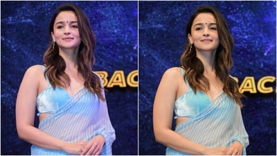 Alia style the six yards with a matching aqua blue-coloured velvet bustier blouse featuring broad shoulder straps with white stripes, a plunging sweetheart neckline, a fitted bust, and a cropped hem length baring her midriff. (HT Photo/Varinder Chawla) Alia style the six yards with a matching aqua blue-coloured velvet bustier blouse featuring broad shoulder straps with white stripes, a plunging sweetheart neckline, a fitted bust, and a cropped hem length baring her midriff. (HT Photo/Varinder Chawla)